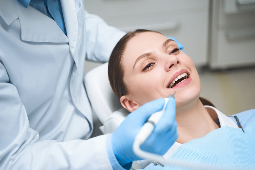 Happy woman during visit to dentist