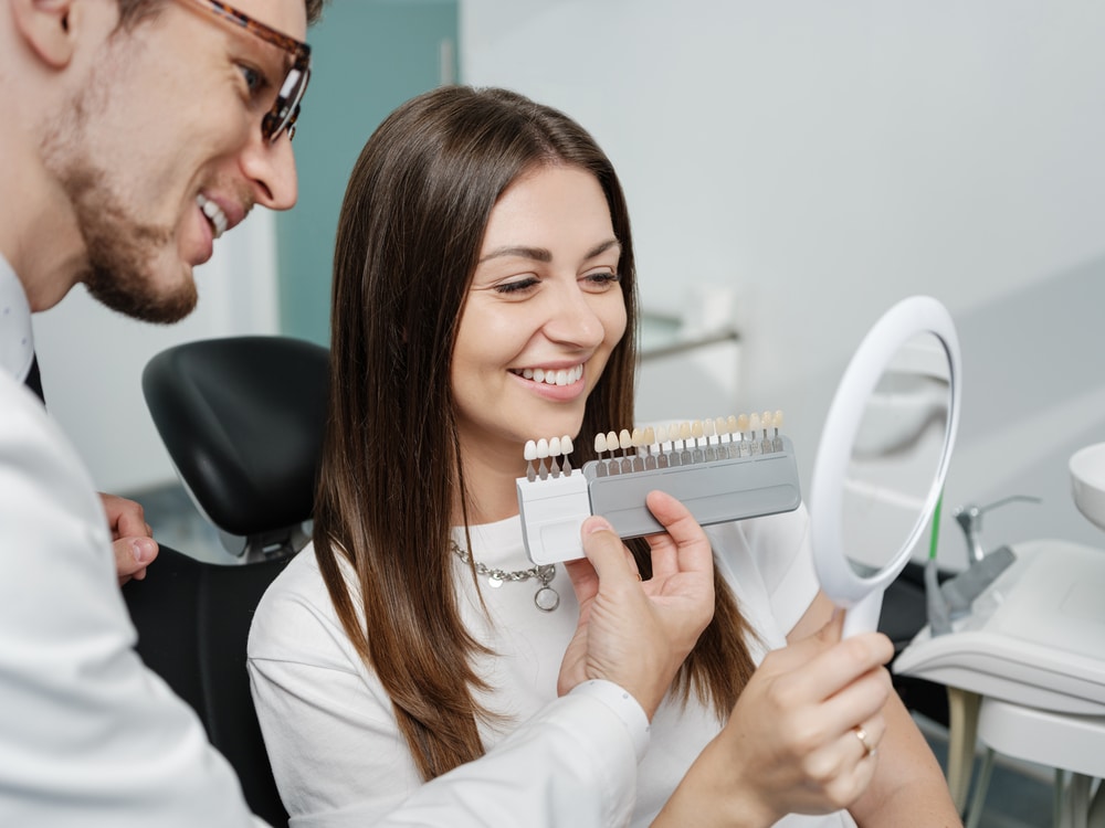 dentist showing a set of veneers